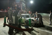 Action in the pitlane during the night