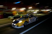 Action in the pitlane during the night