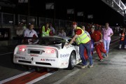 Action in the pitlane by night
